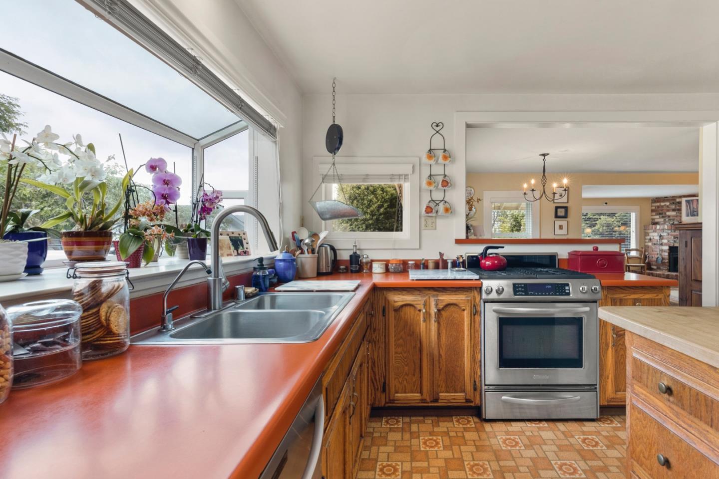 875 Amesti Road Watsonville, CA 95076 - Photo 14 of 52 a kitchen with stove a sink and cabinets