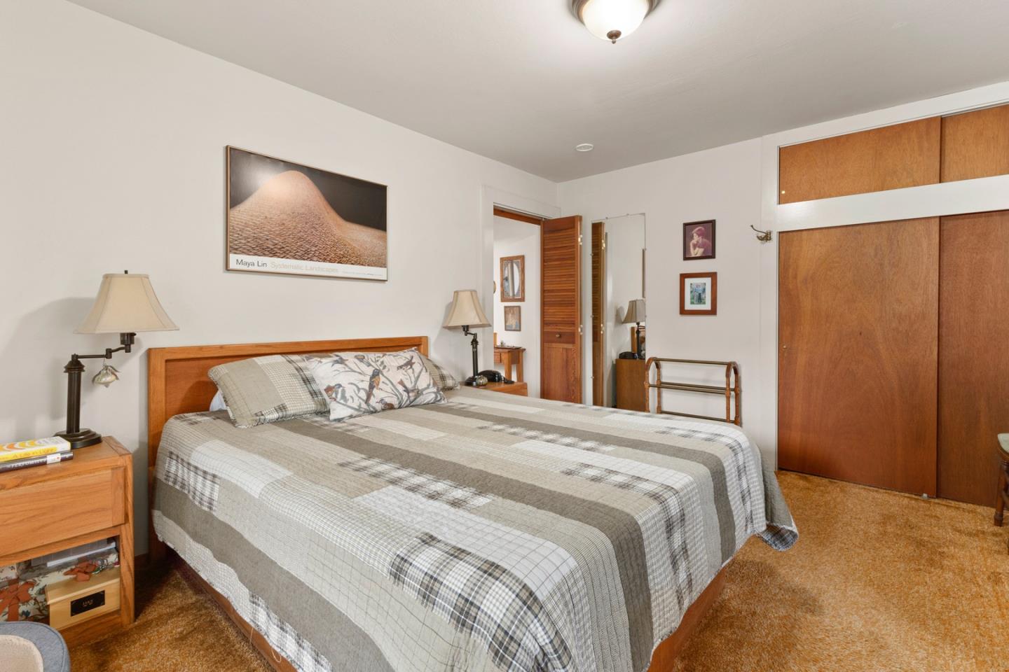 875 Amesti Road Watsonville, CA 95076 - Photo 17 of 52 a bedroom with bed and wooden floor