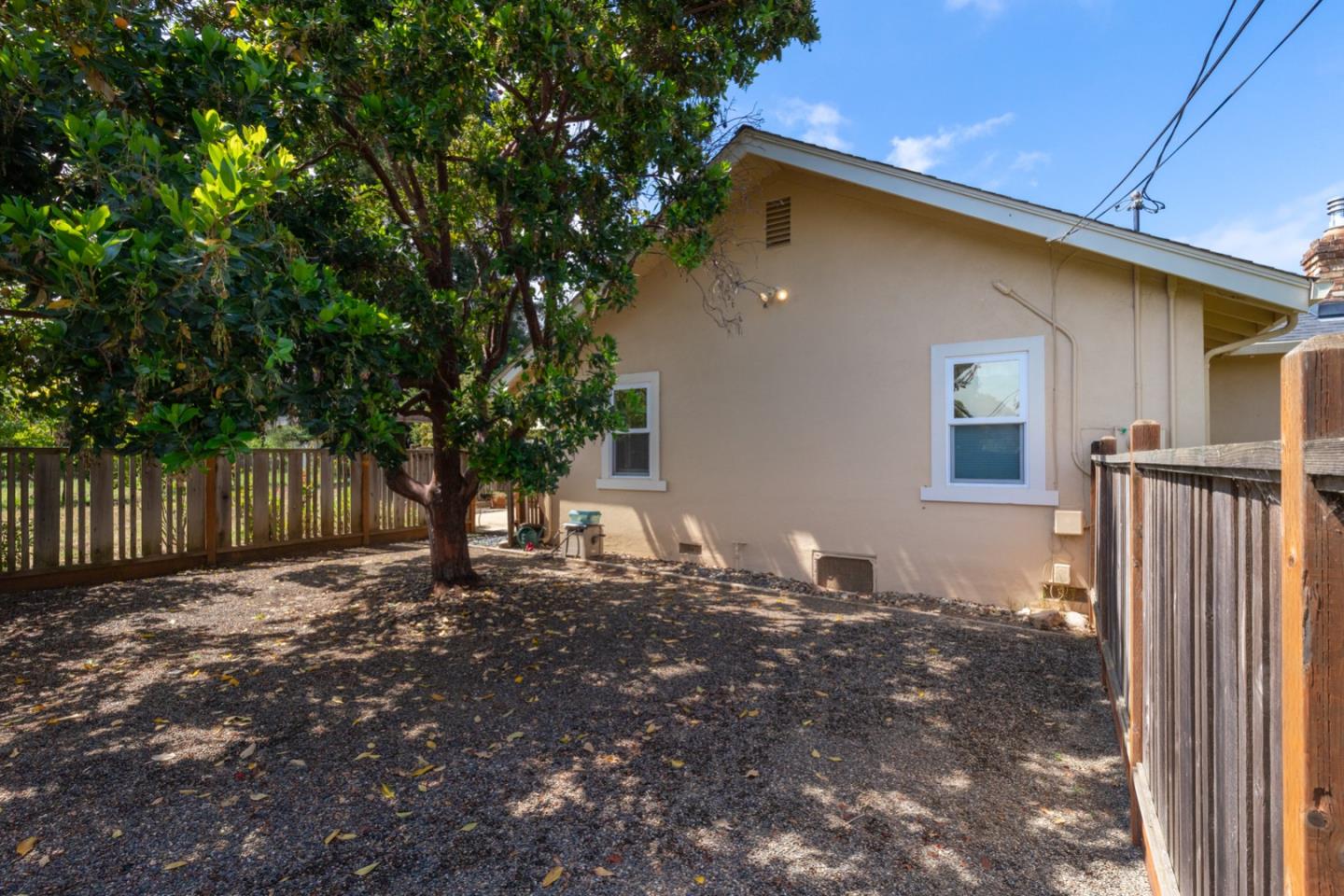 875 Amesti Road Watsonville, CA 95076 - Photo 33 of 52 a backyard of a house with table and chairs