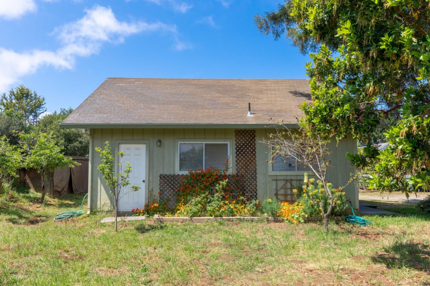 875 Amesti Road Watsonville, CA 95076 - Photo 37 of 52 a front view of a house with a yard