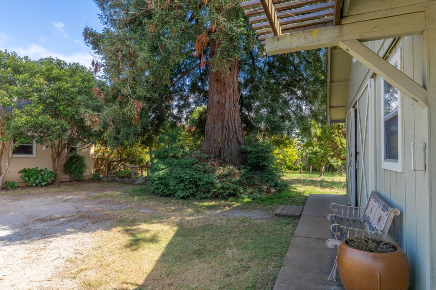 875 Amesti Road Watsonville, CA 95076 - Photo 40 of 52 a view of a porch with furniture and a yard