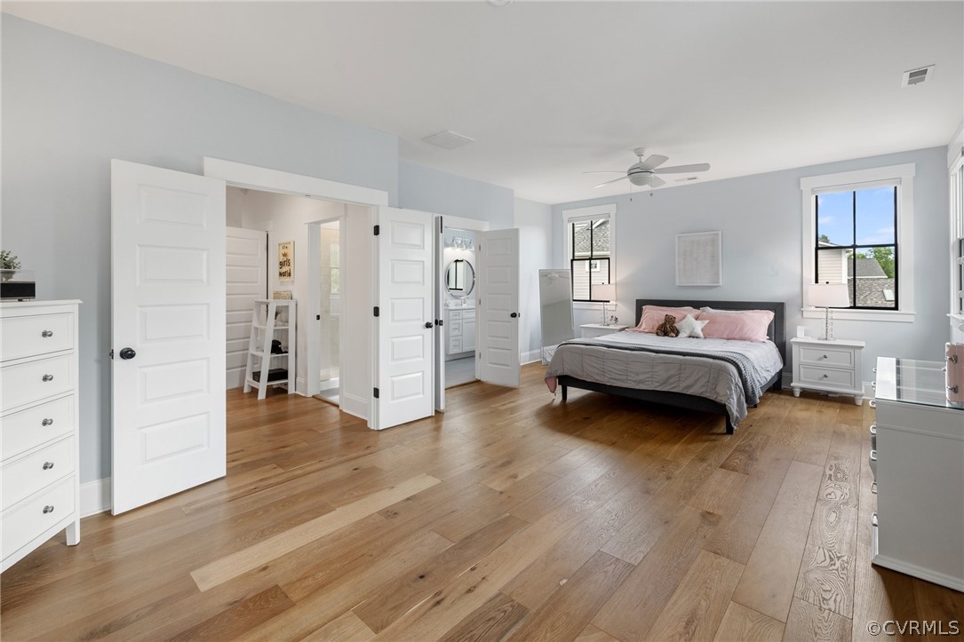 16224 Old Castle Road Midlothian, VA 23112 - Photo 44 of 50 a spacious bedroom with a bed and wooden floor