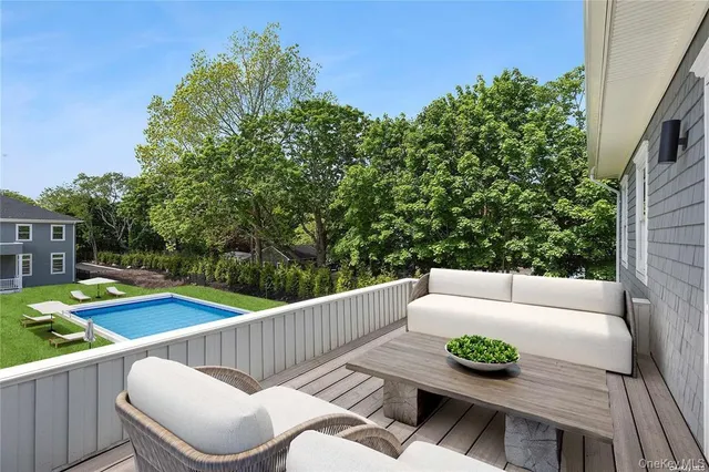 a view of a patio with couches chairs and potted plants