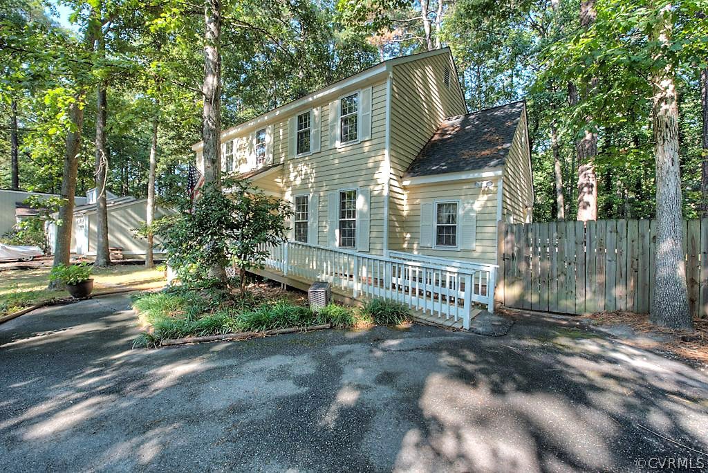 13608 Hunts Bridge Road Midlothian, VA 23112 - Photo 2 of 50 a front view of a house with a garden