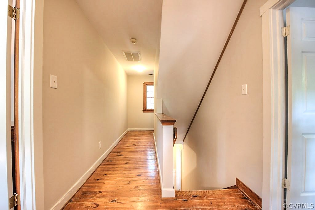 13608 Hunts Bridge Road Midlothian, VA 23112 - Photo 27 of 50 a view of a hallway with wooden floor and staircase