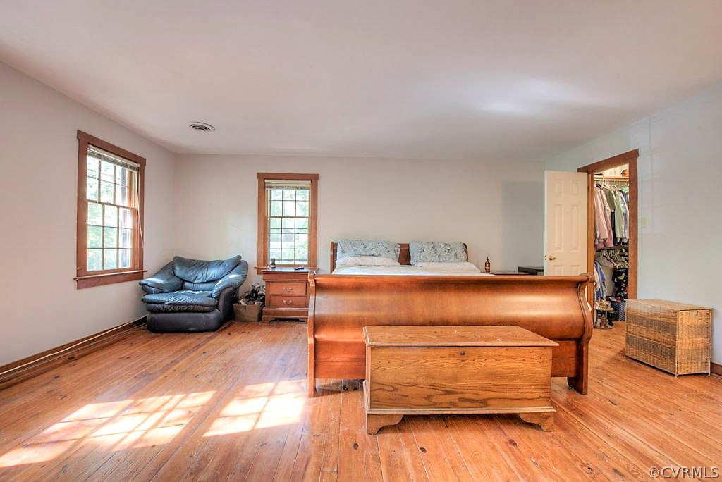 13608 Hunts Bridge Road Midlothian, VA 23112 - Photo 28 of 50 a bedroom with a bed and wooden floor