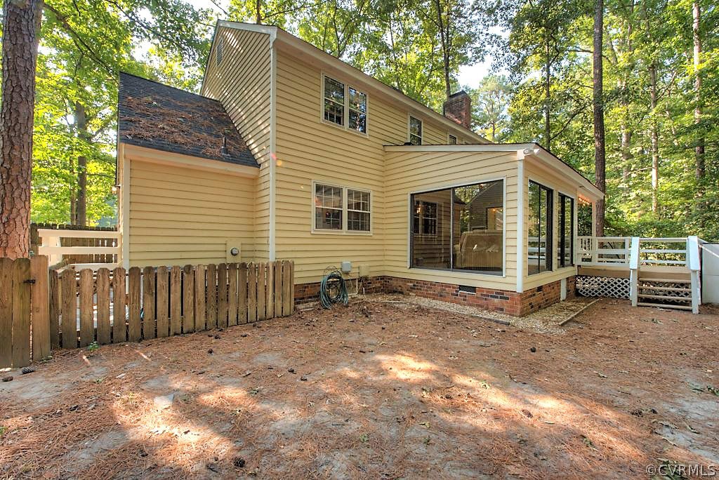 13608 Hunts Bridge Road Midlothian, VA 23112 - Photo 45 of 50 a view of a house with a yard and wooden fence