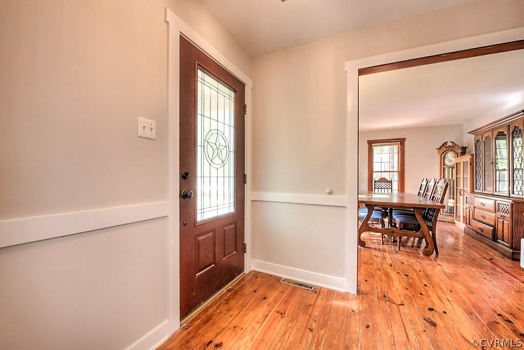 13608 Hunts Bridge Road Midlothian, VA 23112 - Photo 6 of 50 a view of a livingroom with furniture and wooden floor