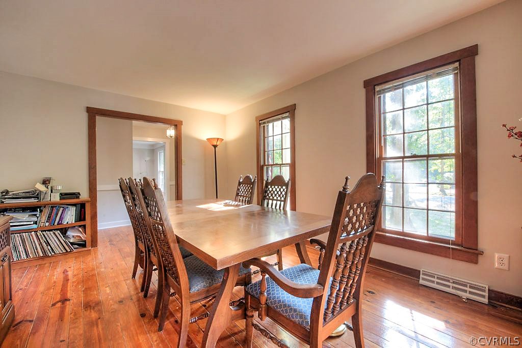 13608 Hunts Bridge Road Midlothian, VA 23112 - Photo 8 of 50 a view of a dining room with furniture and wooden floor
