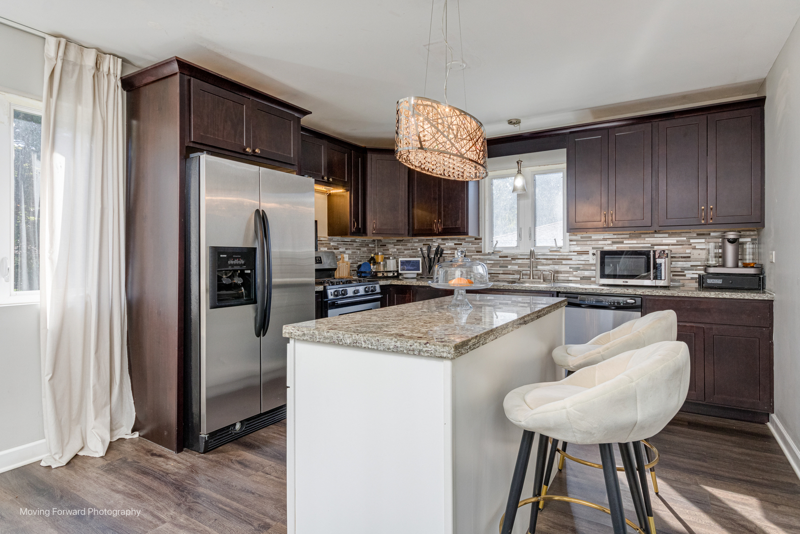 16023 Trumbull Avenue Markham, IL 60428 - Photo 13 of 36 a kitchen with stainless steel appliances granite countertop a refrigerator a sink a stove a microwave and island