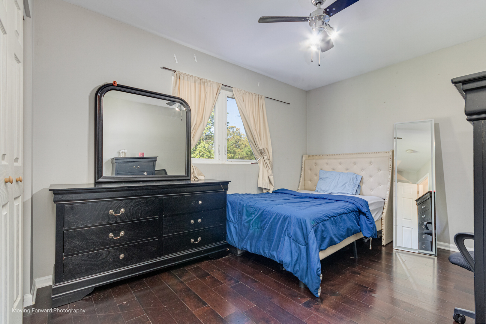 16023 Trumbull Avenue Markham, IL 60428 - Photo 25 of 36 a bedroom with a bed and a mirror