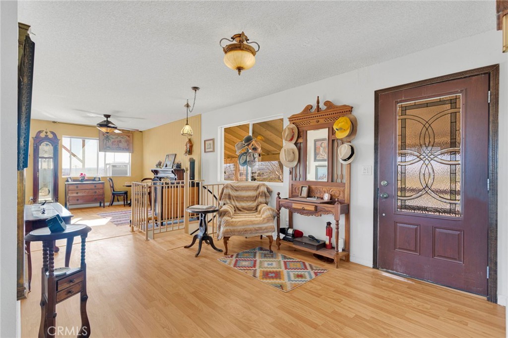 31420 Rabbit Springs Lane Lucerne Valley, CA 92356 - Photo 11 of 72 a living room with furniture and a wooden floor