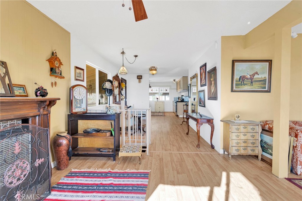 31420 Rabbit Springs Lane Lucerne Valley, CA 92356 - Photo 12 of 72 a living room with furniture and a fireplace