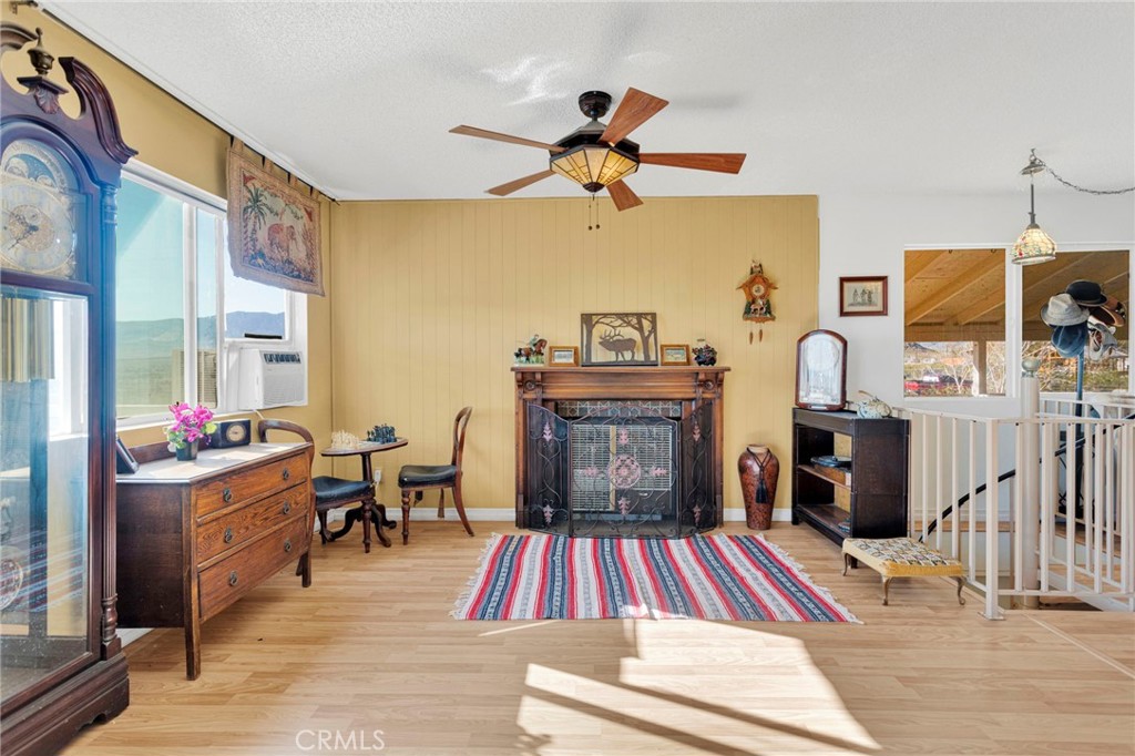 31420 Rabbit Springs Lane Lucerne Valley, CA 92356 - Photo 13 of 72 a living room with furniture a rug and a chandelier