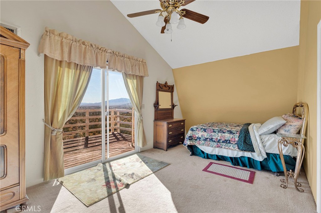 31420 Rabbit Springs Lane Lucerne Valley, CA 92356 - Photo 20 of 72 a bedroom with a bed and a window