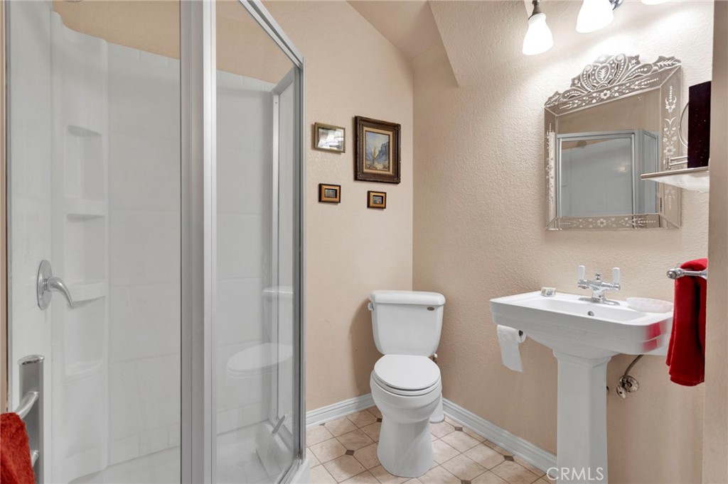31420 Rabbit Springs Lane Lucerne Valley, CA 92356 - Photo 24 of 72 a bathroom with a toilet sink and mirror