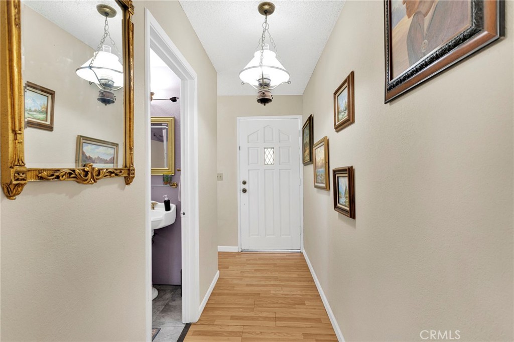 31420 Rabbit Springs Lane Lucerne Valley, CA 92356 - Photo 27 of 72 a view of a hallway with wooden floor and staircase