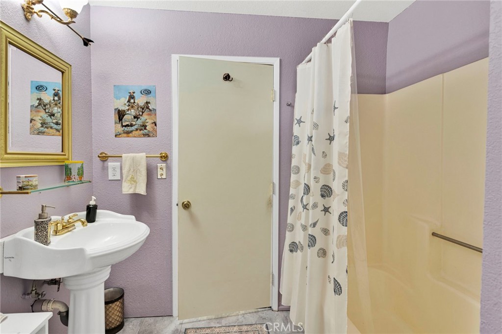 31420 Rabbit Springs Lane Lucerne Valley, CA 92356 - Photo 29 of 72 a bathroom with a sink and a mirror
