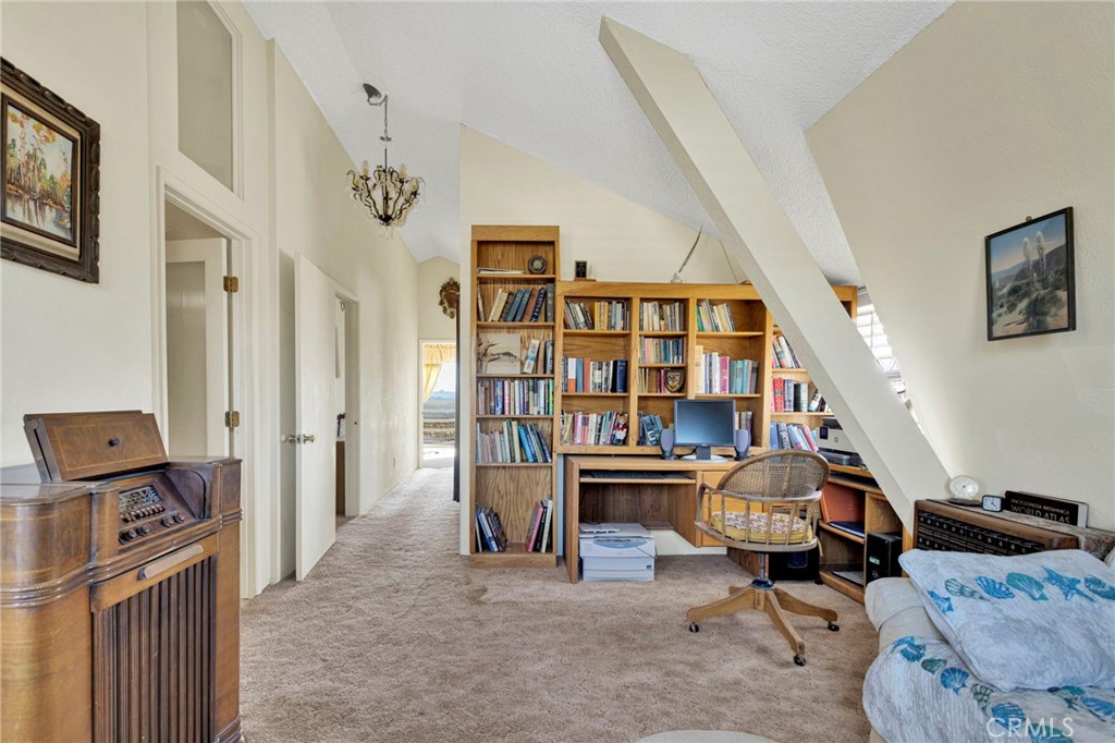 31420 Rabbit Springs Lane Lucerne Valley, CA 92356 - Photo 33 of 72 a view of a livingroom with furniture and staircase