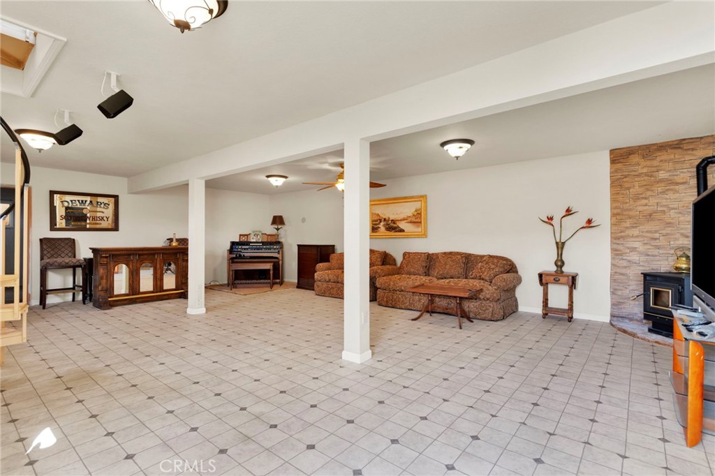 31420 Rabbit Springs Lane Lucerne Valley, CA 92356 - Photo 36 of 72 a living room with furniture and a wooden floor