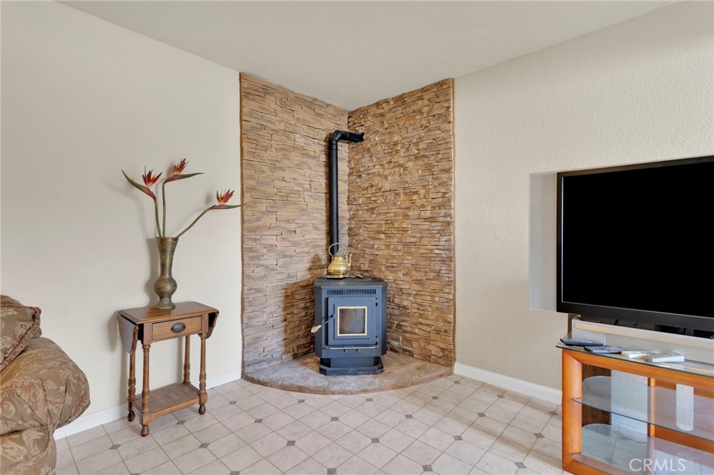 31420 Rabbit Springs Lane Lucerne Valley, CA 92356 - Photo 38 of 72 a living room with furniture and a flat screen tv