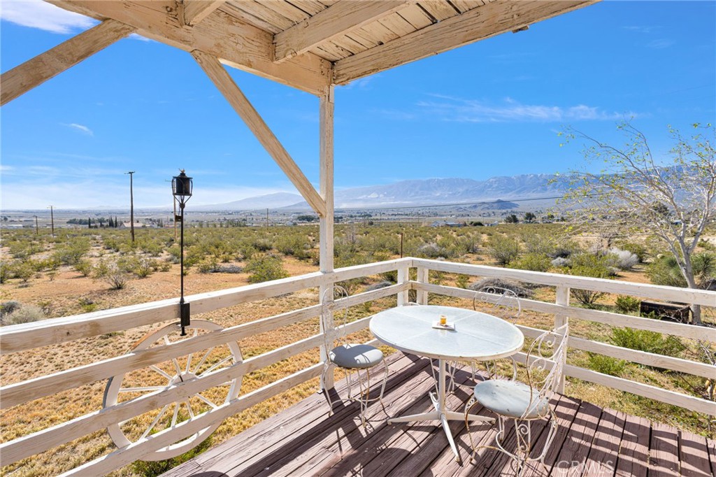 31420 Rabbit Springs Lane Lucerne Valley, CA 92356 - Photo 45 of 72 a view of a balcony with table and chairs