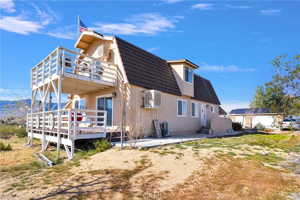 31420 Rabbit Springs Lane Lucerne Valley, CA 92356 - Photo 47 of 72 a view of a house with a patio