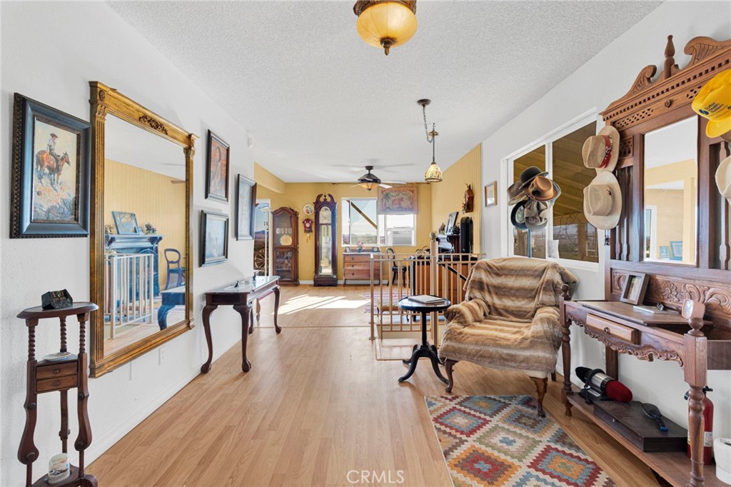 31420 Rabbit Springs Lane Lucerne Valley, CA 92356 - Photo 5 of 72 a living room with furniture and a floor to ceiling window