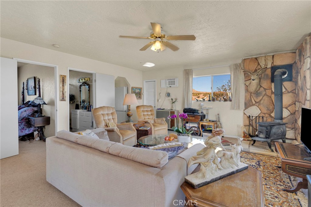 31420 Rabbit Springs Lane Lucerne Valley, CA 92356 - Photo 53 of 72 a living room with furniture and wooden floor