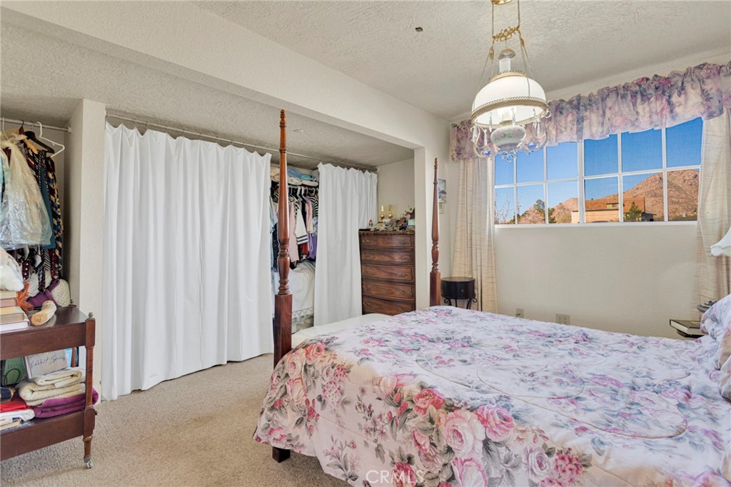 31420 Rabbit Springs Lane Lucerne Valley, CA 92356 - Photo 59 of 72 a bedroom with a bed and a window