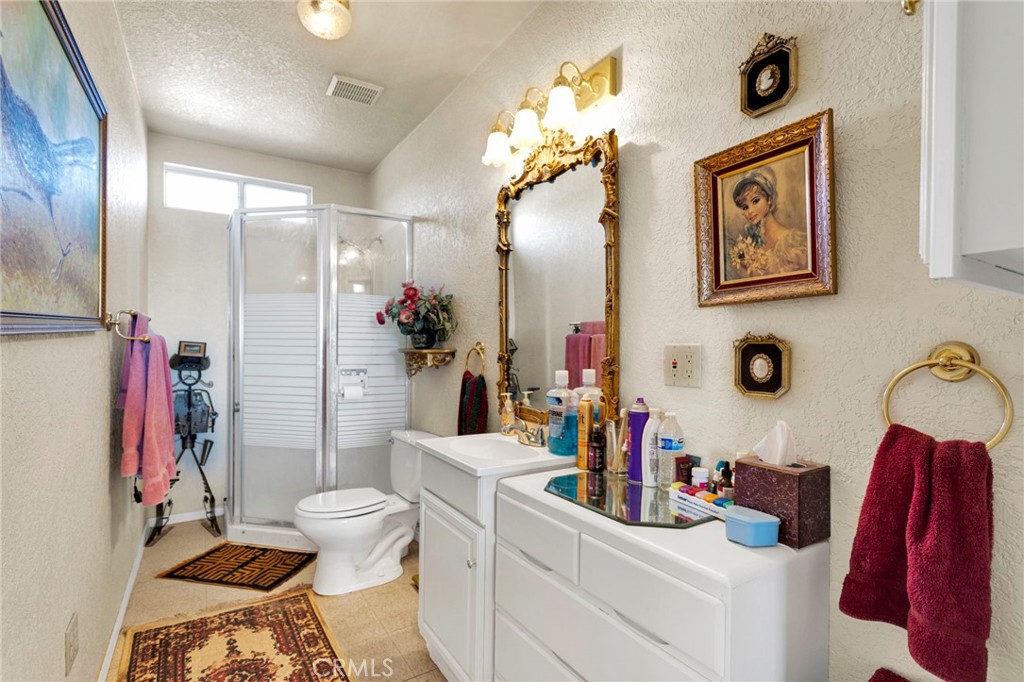 31420 Rabbit Springs Lane Lucerne Valley, CA 92356 - Photo 60 of 72 a bathroom with a sink vanity mirror and toilet