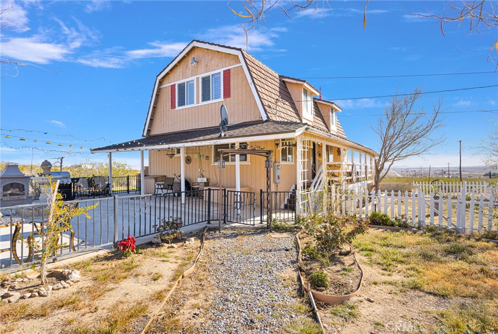 31420 Rabbit Springs Lane Lucerne Valley, CA 92356 - Photo 64 of 72 a view of a house with a wooden fence