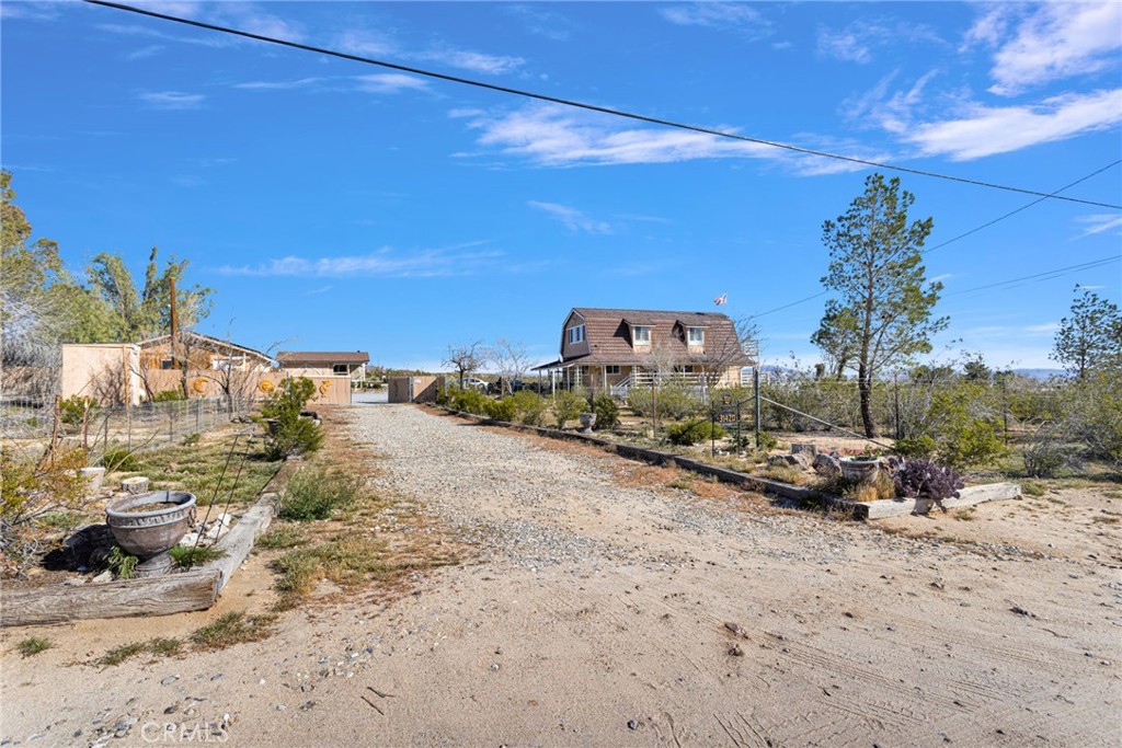 31420 Rabbit Springs Lane Lucerne Valley, CA 92356 - Photo 68 of 72 a car parked on the side of the road