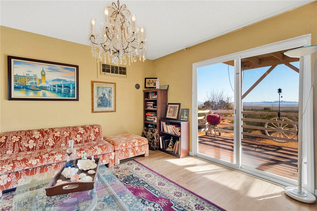 31420 Rabbit Springs Lane Lucerne Valley, CA 92356 - Photo 10 of 72 a bedroom with a bed and a chandelier