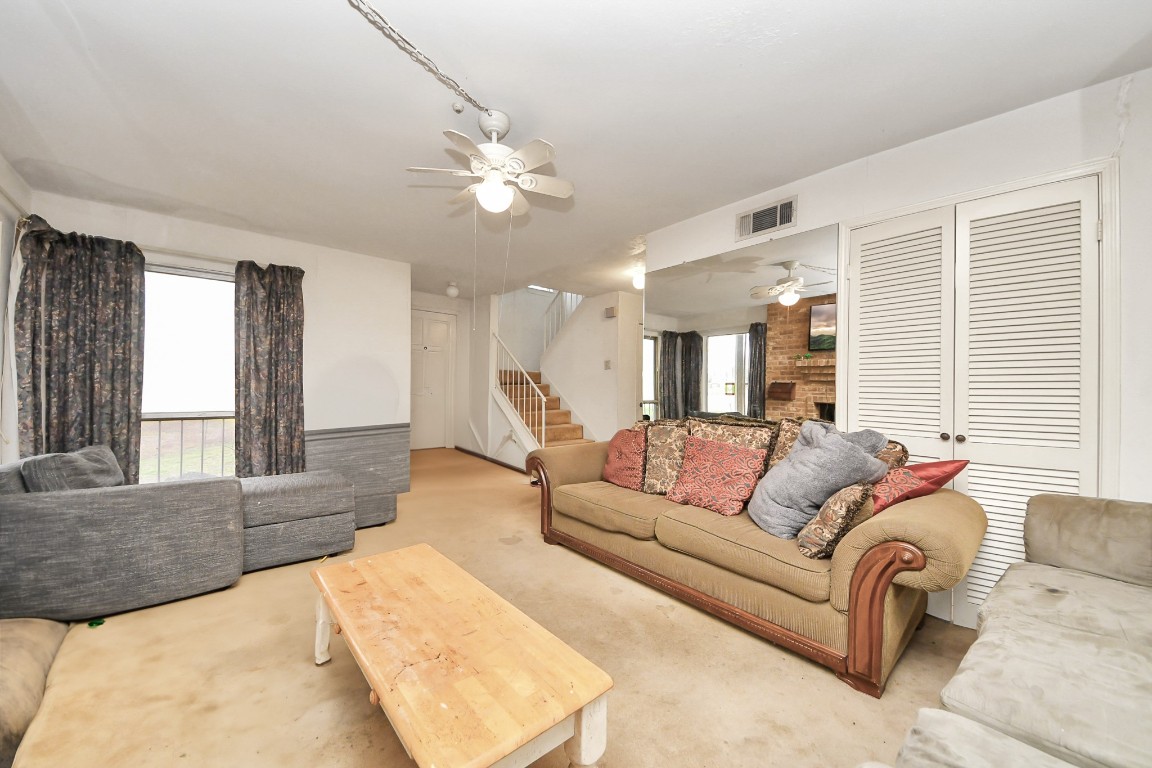 7728 Challie Lane Houston, TX 77088 - Photo 14 of 28 a living room with furniture and a large window