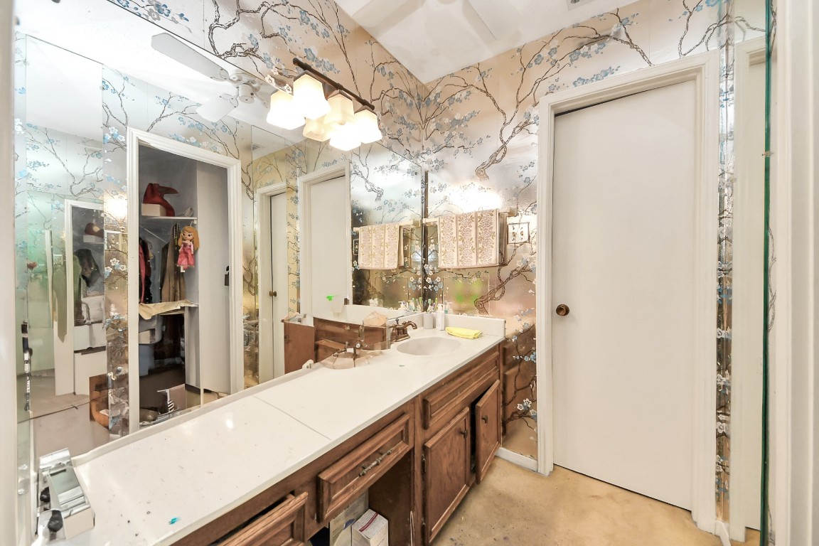7728 Challie Lane Houston, TX 77088 - Photo 18 of 28 a spacious bathroom with a double vanity sink and a mirror