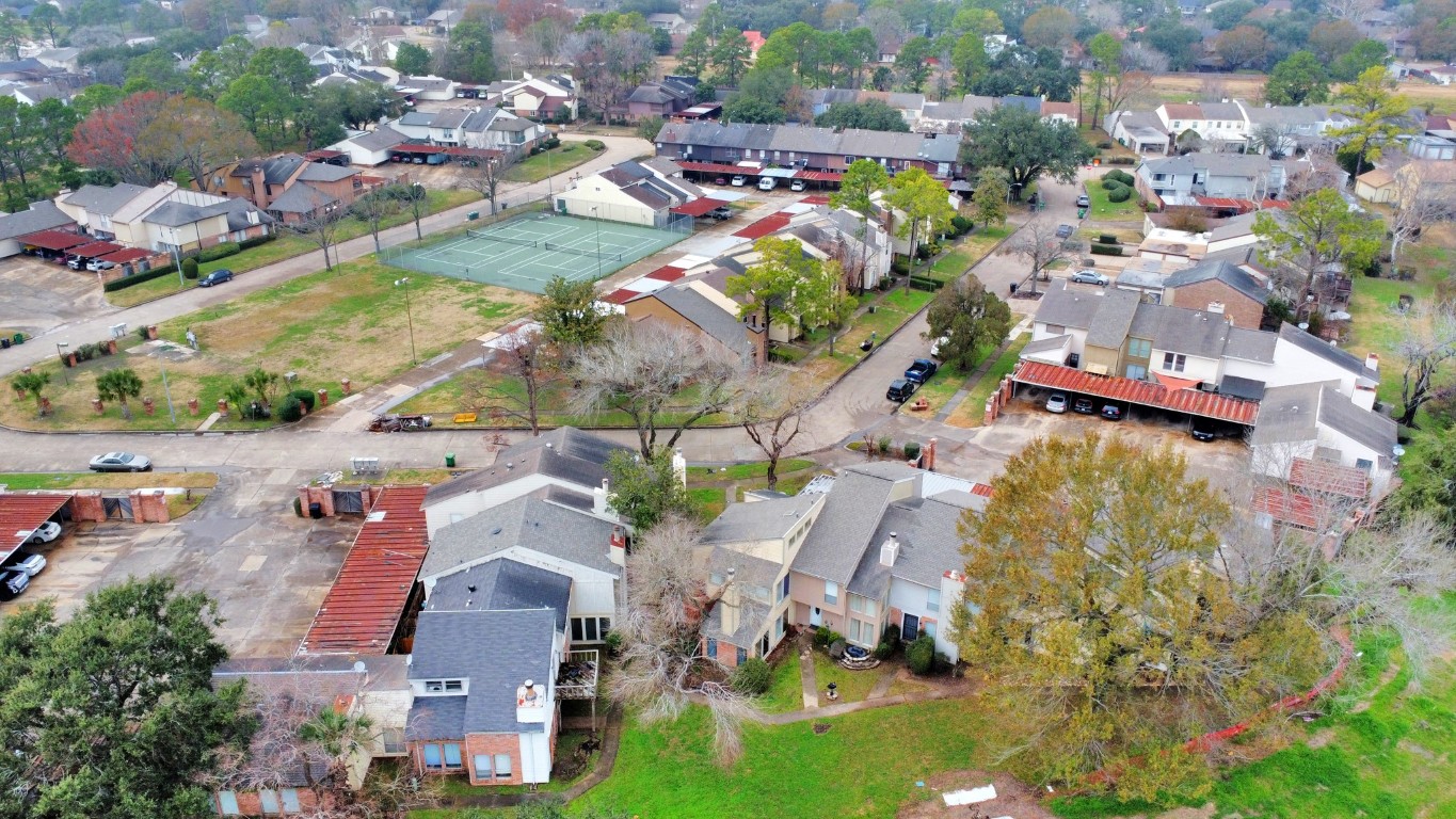 7728 Challie Lane Houston, TX 77088 - Photo 28 of 28 an aerial view of residential houses with outdoor space