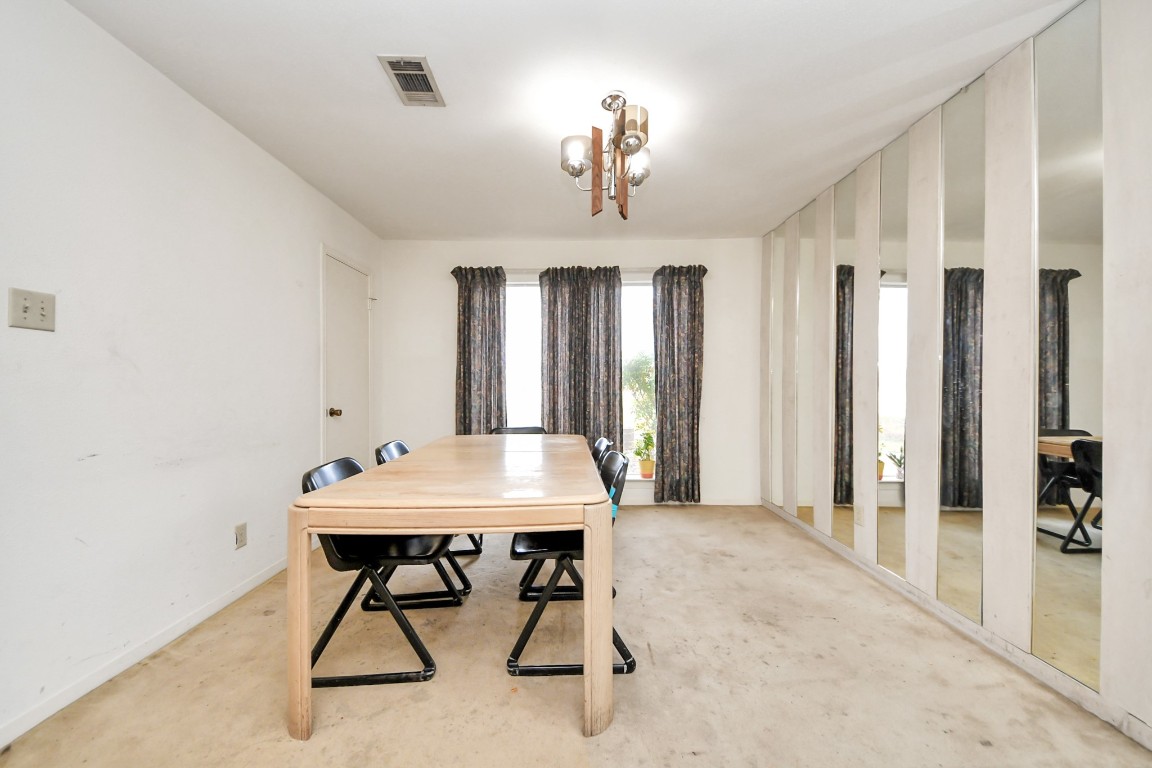 7728 Challie Lane Houston, TX 77088 - Photo 8 of 28 a view of a room with gym equipment