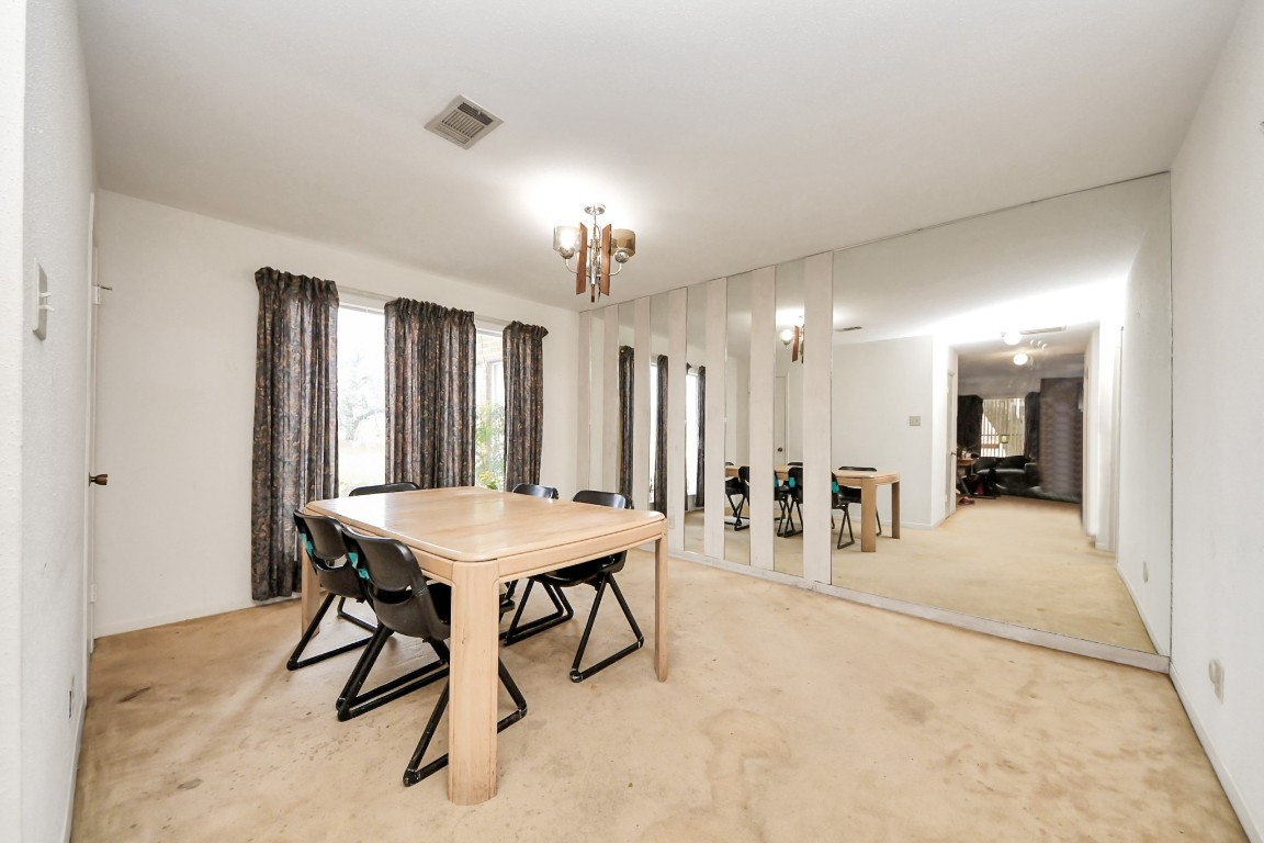 7728 Challie Lane Houston, TX 77088 - Photo 9 of 28 a view of a a dining room with furniture window and wooden floor
