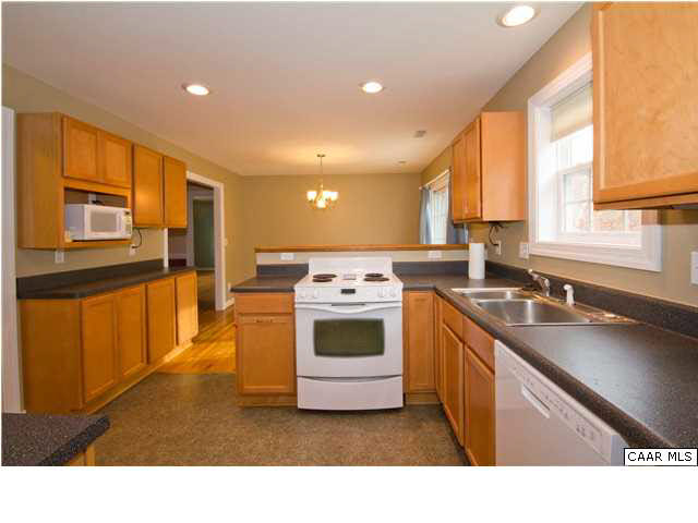 93 Riverside Drive Palmyra, VA 22963 - Photo 8 of 21 a kitchen with a sink stove and cabinets