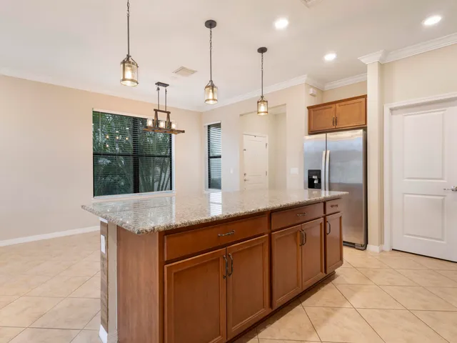 a kitchen with granite countertop cabinets stainless steel appliances and a sink
