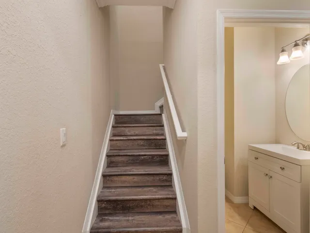 an empty room with wooden floor