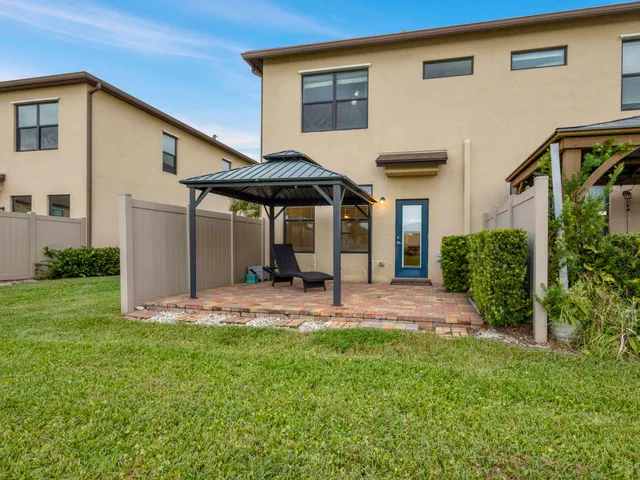 a view of a lake with houses in the background
