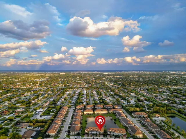 an aerial view of city and mountain
