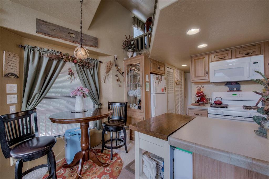92 Sunshine Loop Fairplay, CO 80440 - Photo 16 of 35 a view of a kitchen and dining area