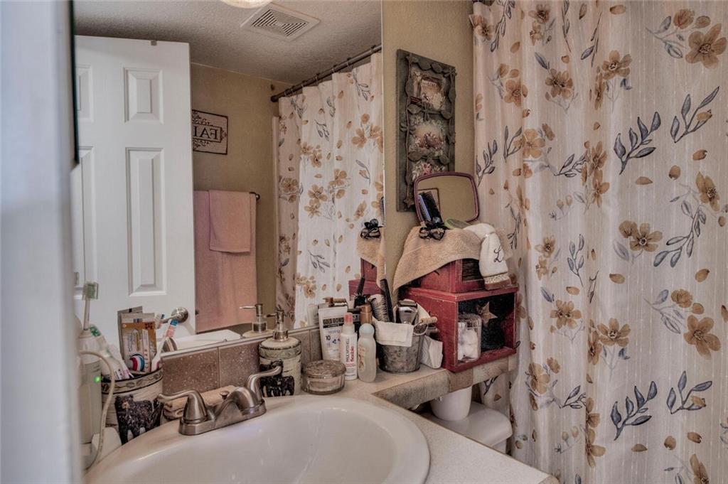 92 Sunshine Loop Fairplay, CO 80440 - Photo 21 of 35 a bathroom with a sink and a mirror
