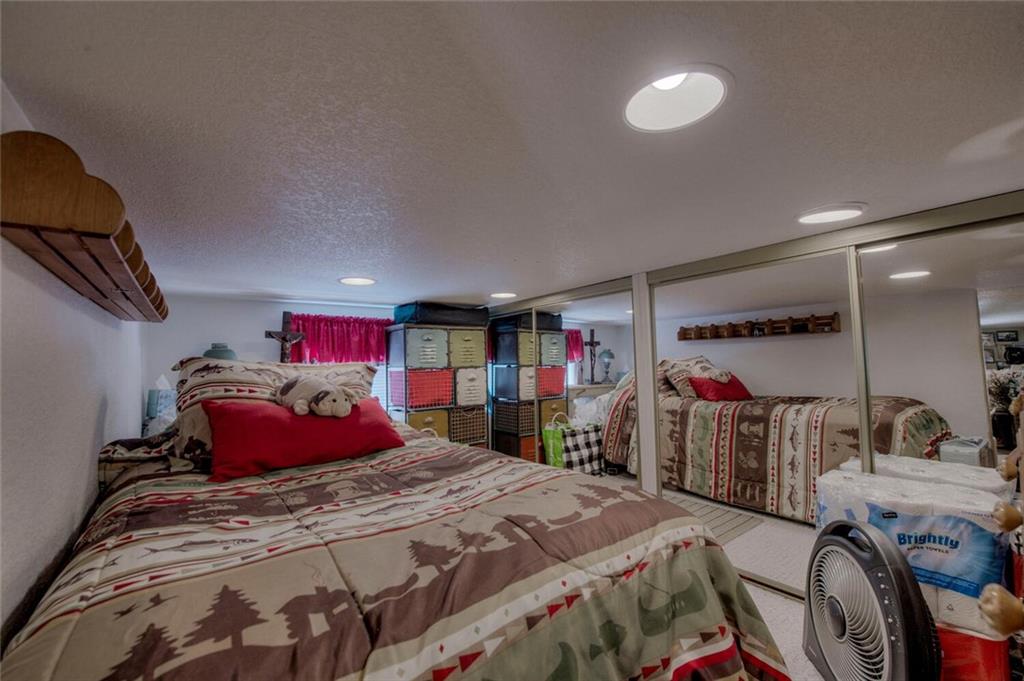 92 Sunshine Loop Fairplay, CO 80440 - Photo 25 of 35 a bedroom with a bed and a closet