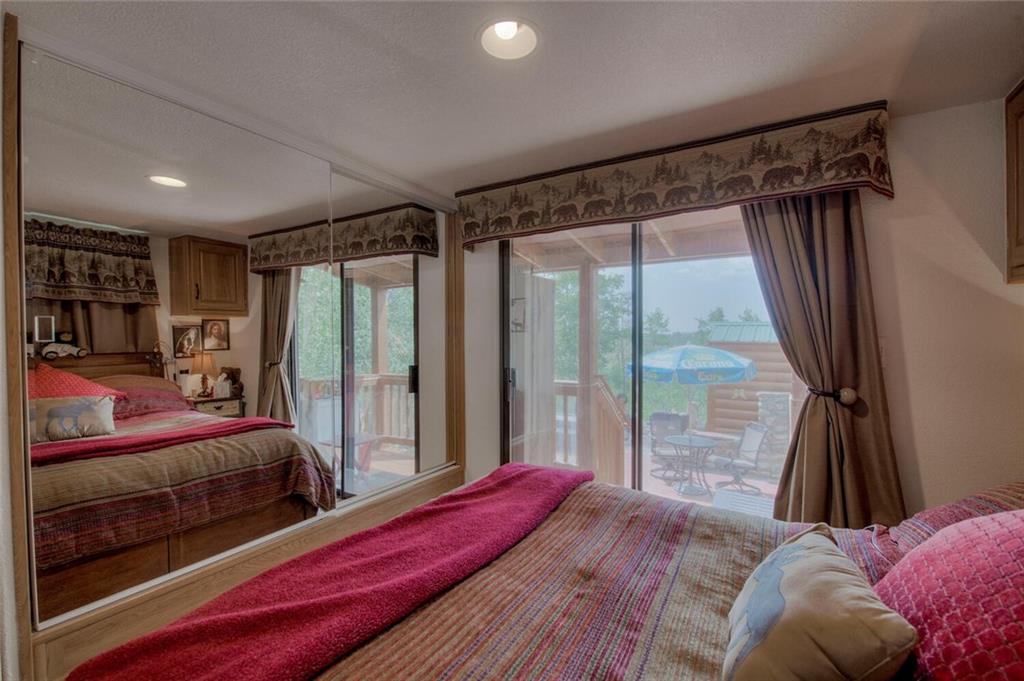 92 Sunshine Loop Fairplay, CO 80440 - Photo 28 of 35 a bedroom with a bed and a large window