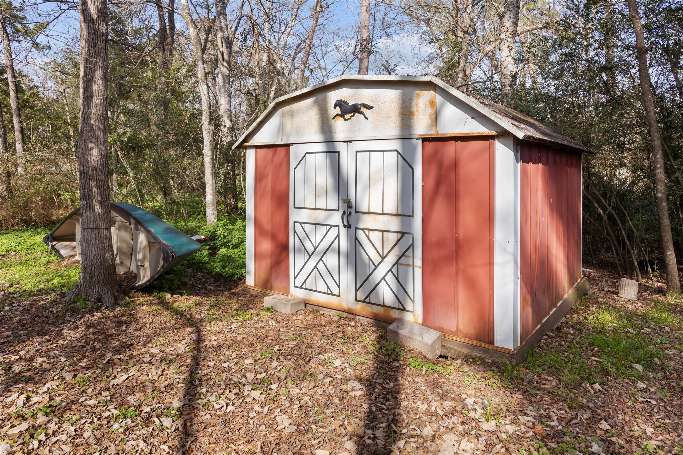 20 Shannon Street Huntsville, TX 77320 - Photo 23 of 29 a view of a house with a yard and garage