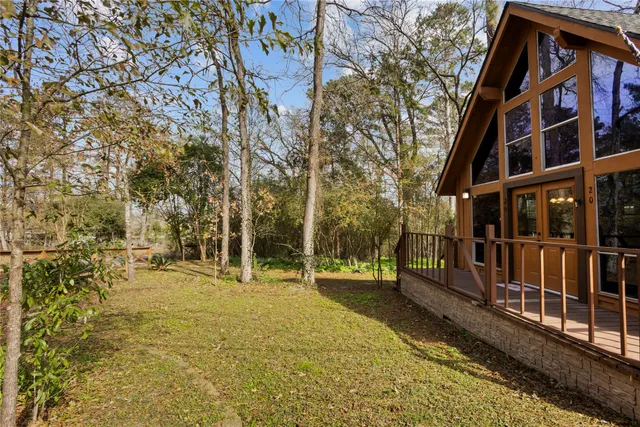 a view of outdoor space with deck and tree